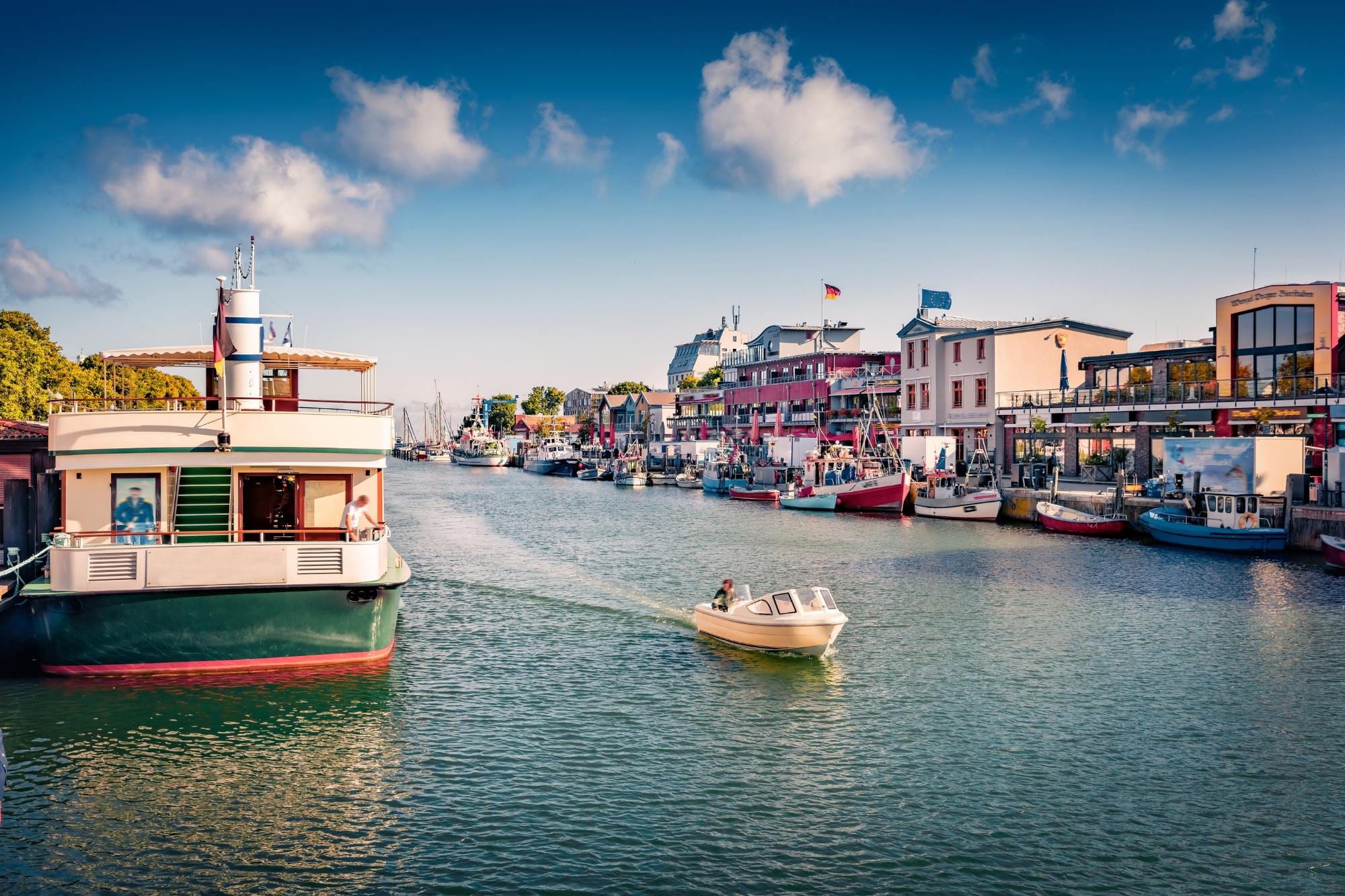 Views of the harbour of Warnemünde and several boats.