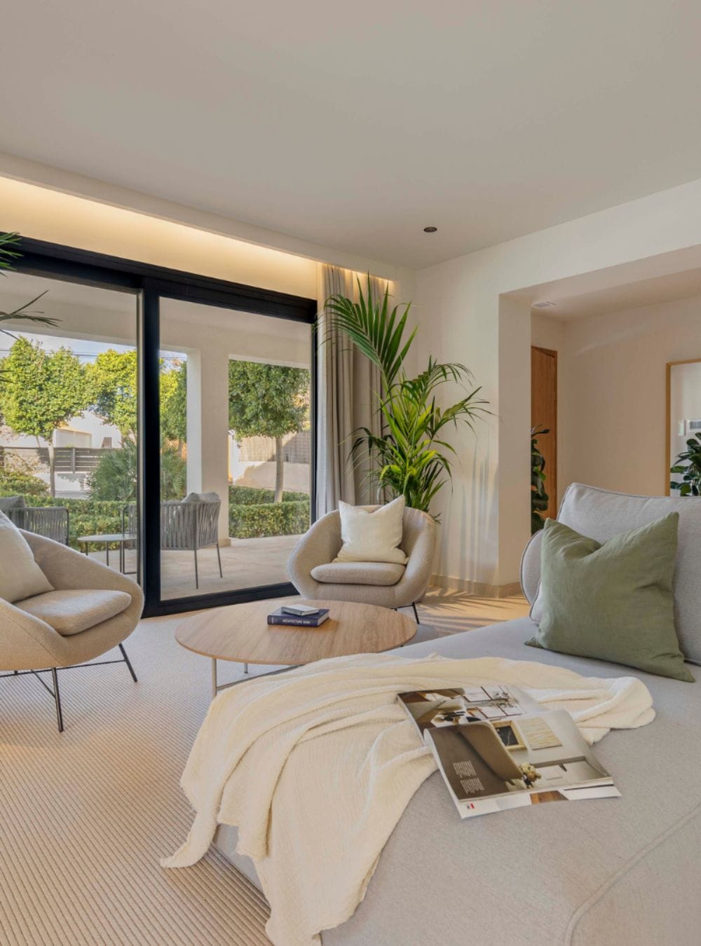 A modern living room with books on the table.