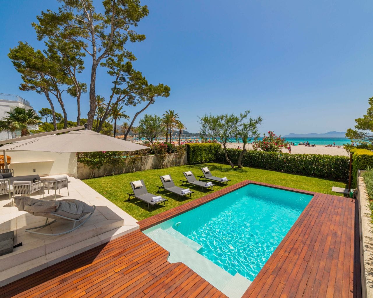 Garden with pool by the beach.