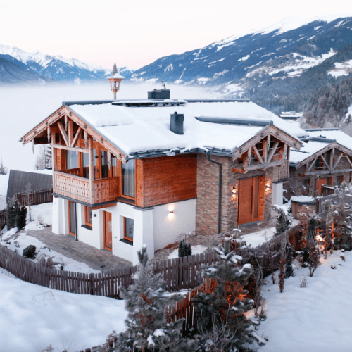 Modern chalet surrounded by mountains in Austria.