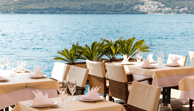 Set tables by the sea.