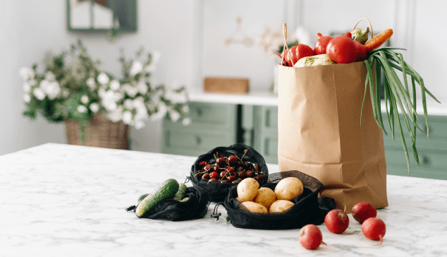 Grocery bags on a kitchen island.